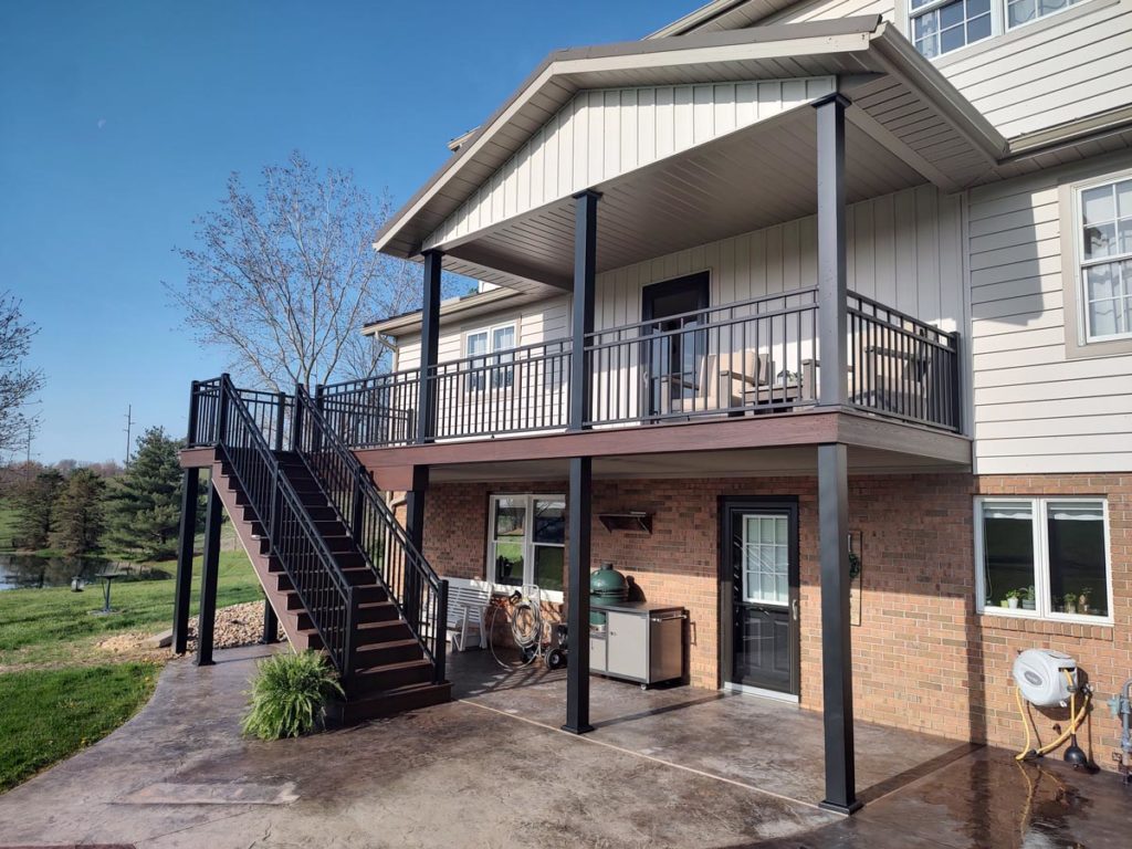 Brown Backyard Deck with Black Aluminum Railing
