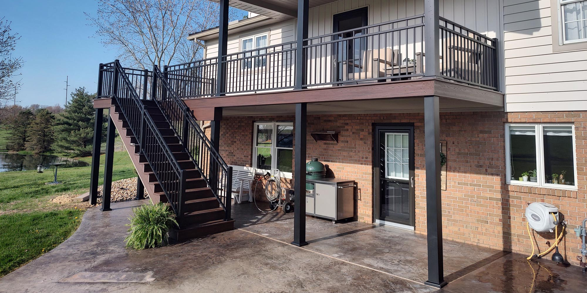Backyard composite deck by custom deck builder in Dundee, OH.