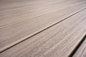 Close-up of composite decking boards with a textured wood-grain finish