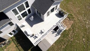 Aerial view of a spacious multi-level backyard deck with stairs and outdoor seating.